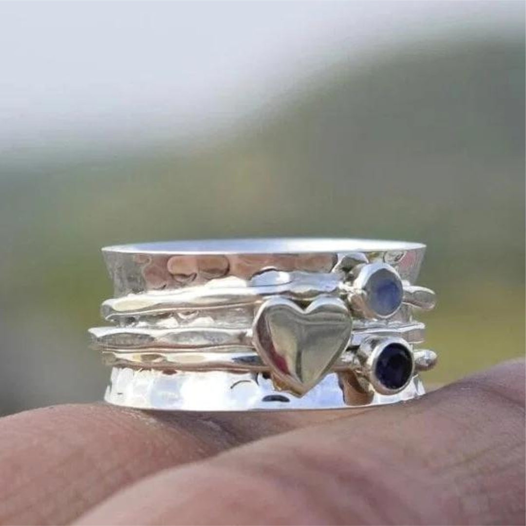 Anillo de corazón giratorio
