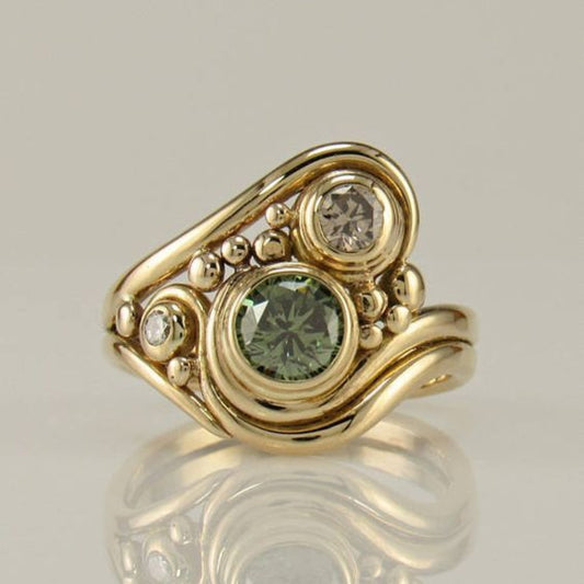 Anillo vintage con circonia dorada y verde