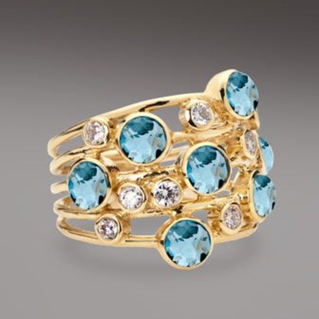 Anillo dorado con circonia incrustada azul vintage