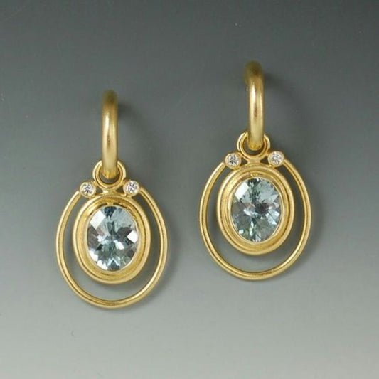 Pendientes Dorados con Cristales Azules y Talla en Relief Vintage