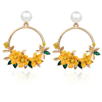 Pendientes de flor y perla de oro