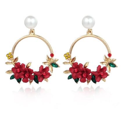 Pendientes de flor y perla de oro