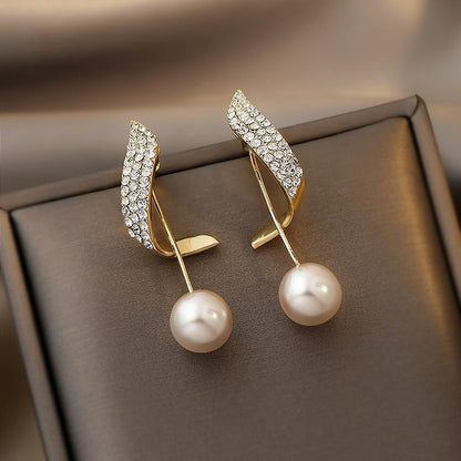 Pendientes de perlas doradas