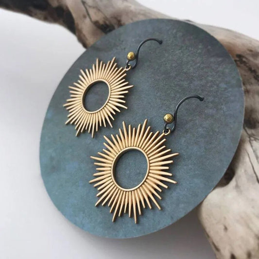 Pendientes vintage huecos de oro con sol