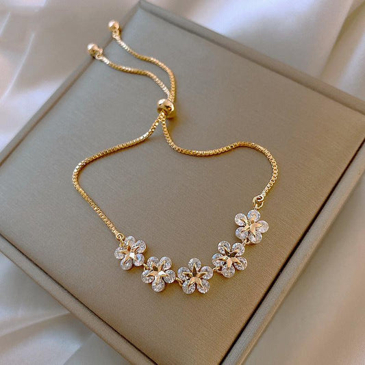 Pulsera de cristal Daisy en dorado