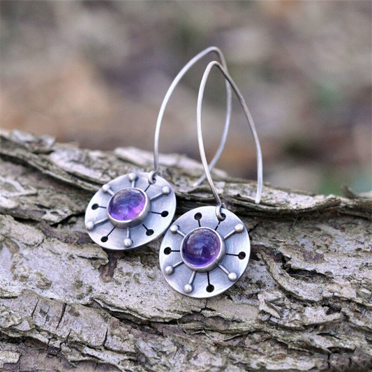 Pendientes vintage redondeados de cristal morado