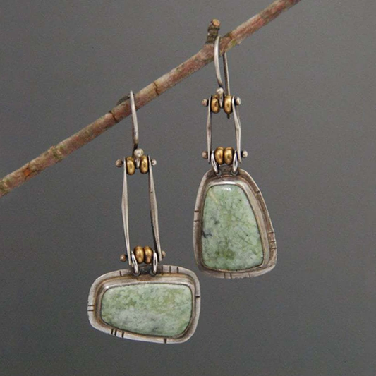 Pendientes vintage plateados con tono verdoso