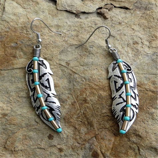 Pendientes vintage de pluma turquesa