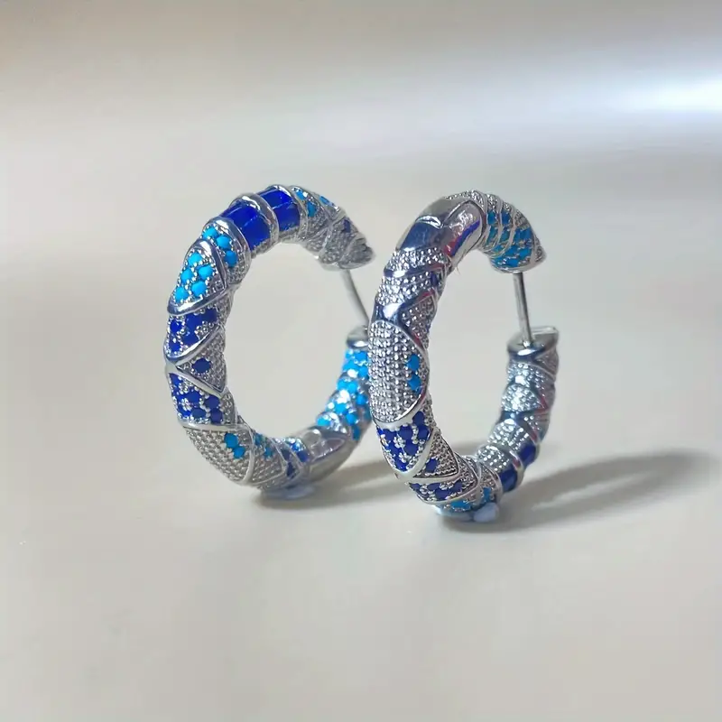 Aretes de aros plateados y azules vintage