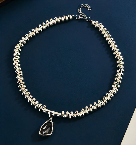 Pulsera de cristal con perlas plateadas